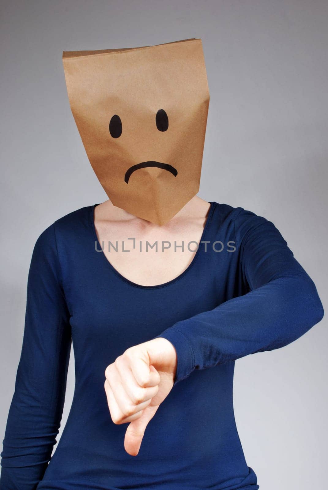a person symbolizes sadness or something mad, gray background