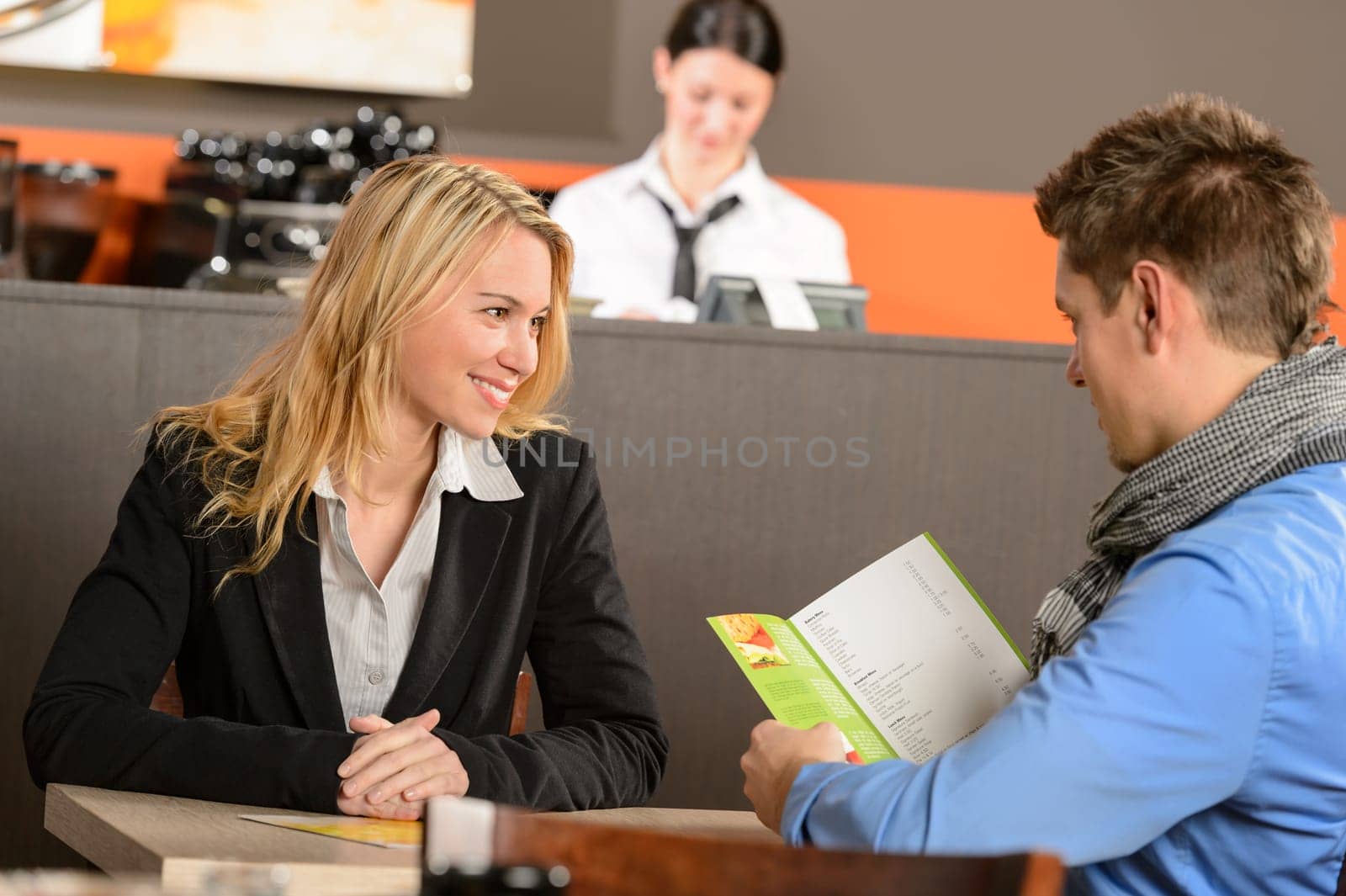 Lovely romantic couple dating in bar ready to order
