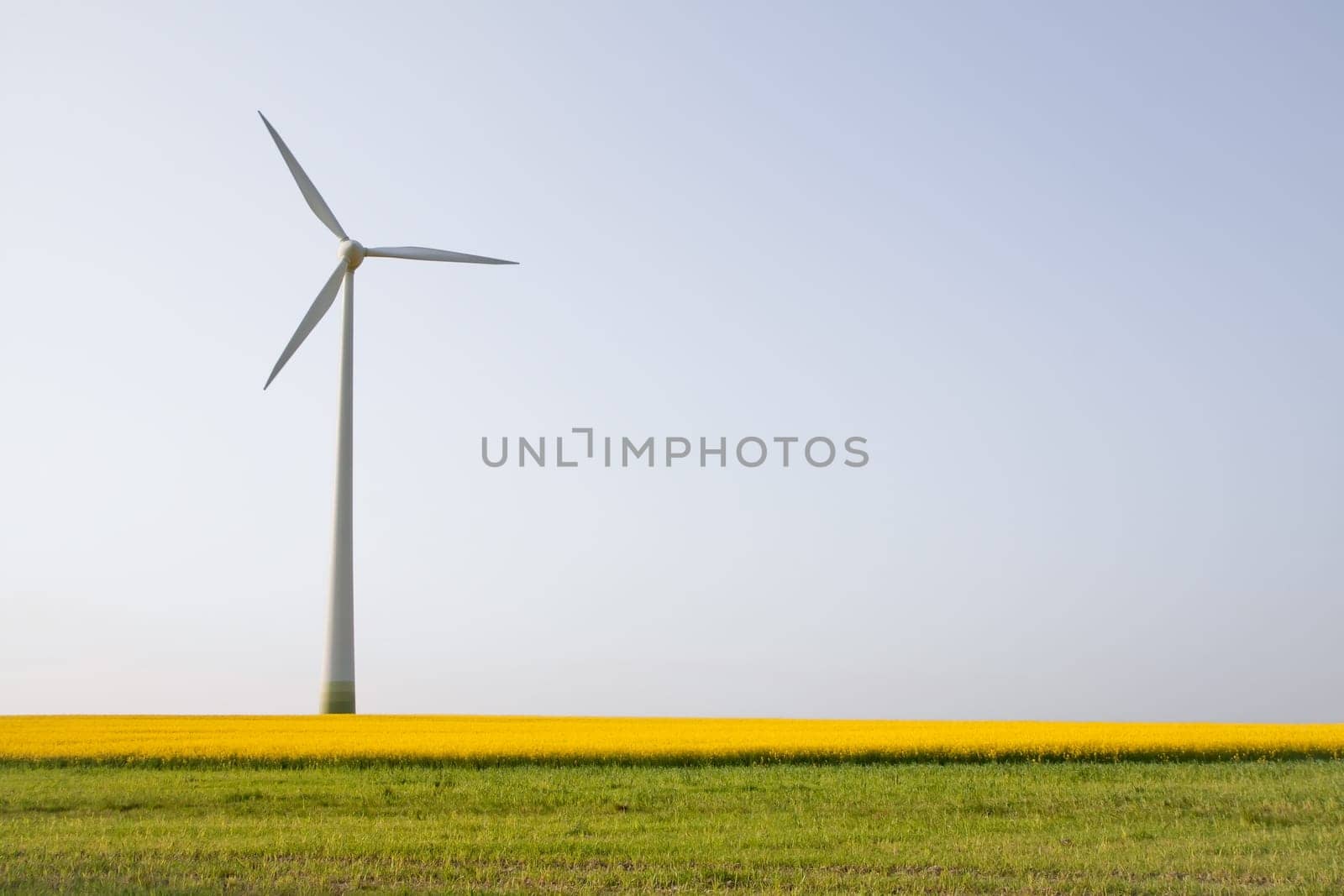 Windmill over horizon line, alternatively energy source
