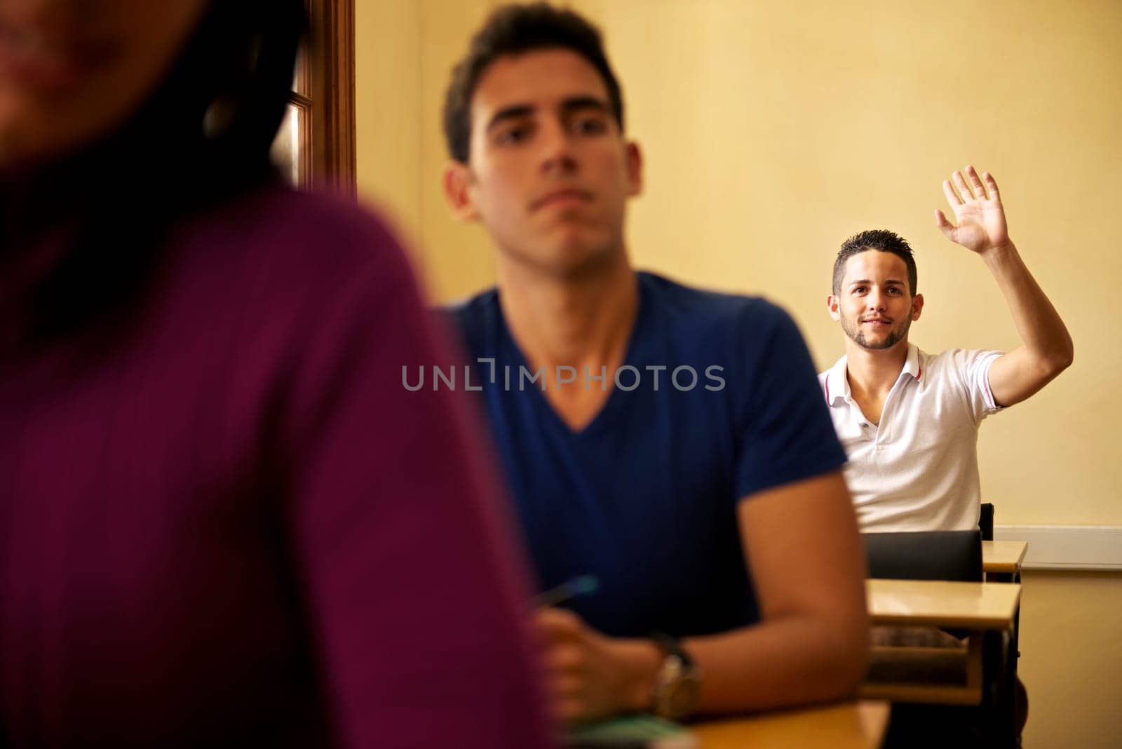 People at school, student raising hand and asking question to professor during class in college, Law School, University of Havana, Cuba