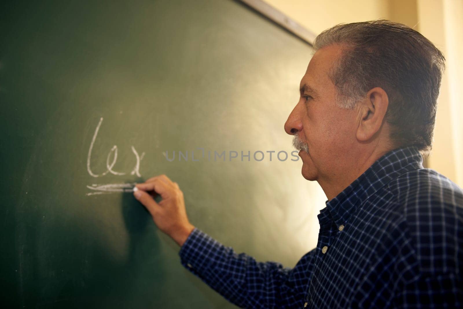 People and education, professor writing on board during lesson in college, Law School, University of Havana, Cuba