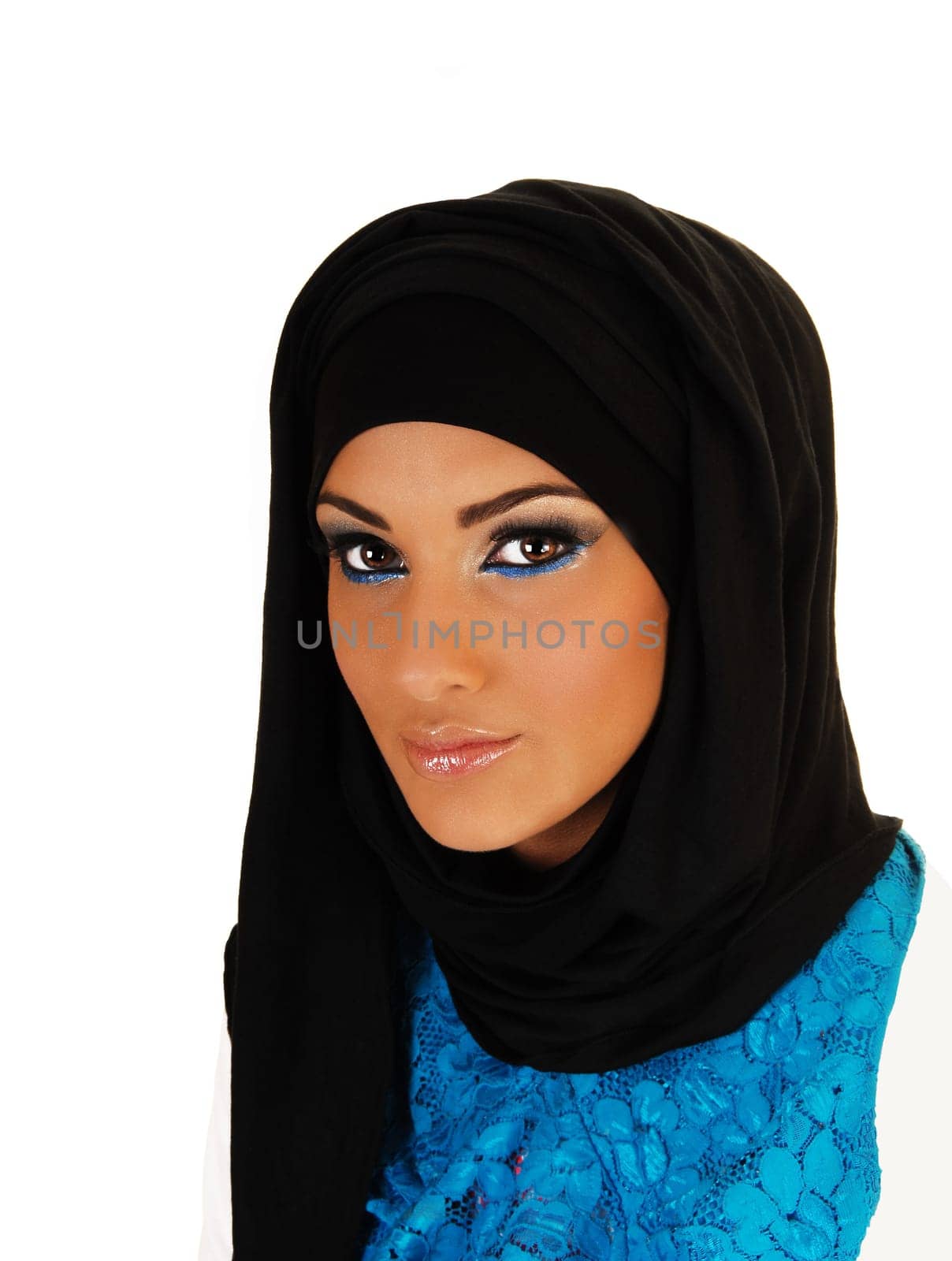 A pretty and young teen girl with a black headscarf and nice makeup looking into the camera for white background.