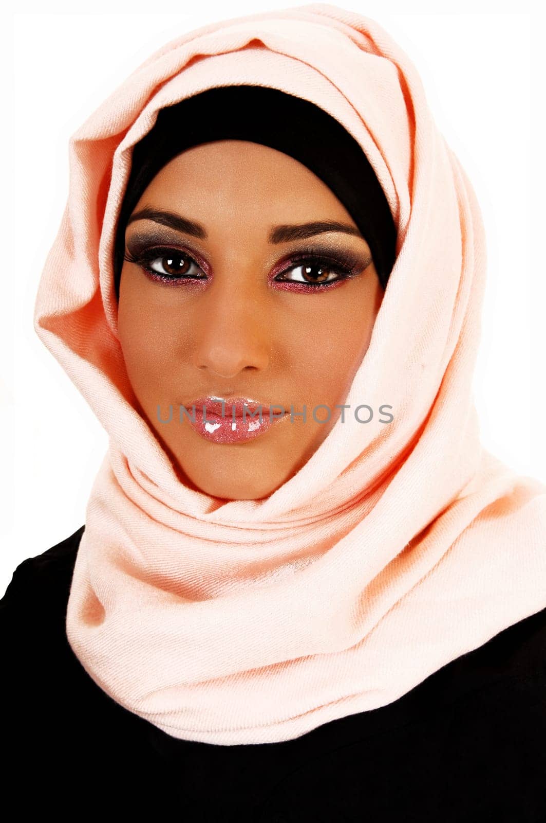 A young lovely teenager girl in a black jacket and a pink headscarf for white background, a portrait shoot.