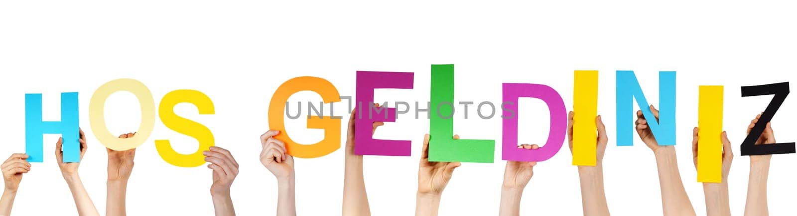 hands hold the turkish word HOS GELDINIZ, which means welcome, isolated