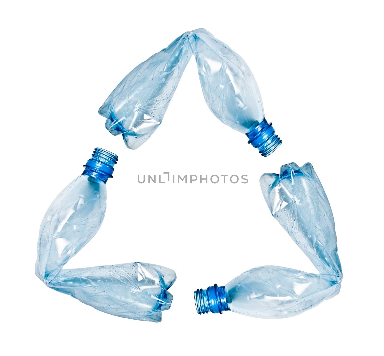 three blue plastic water bottles bent and put together to make up recycle symbol. Objects isolated on white, no shadow