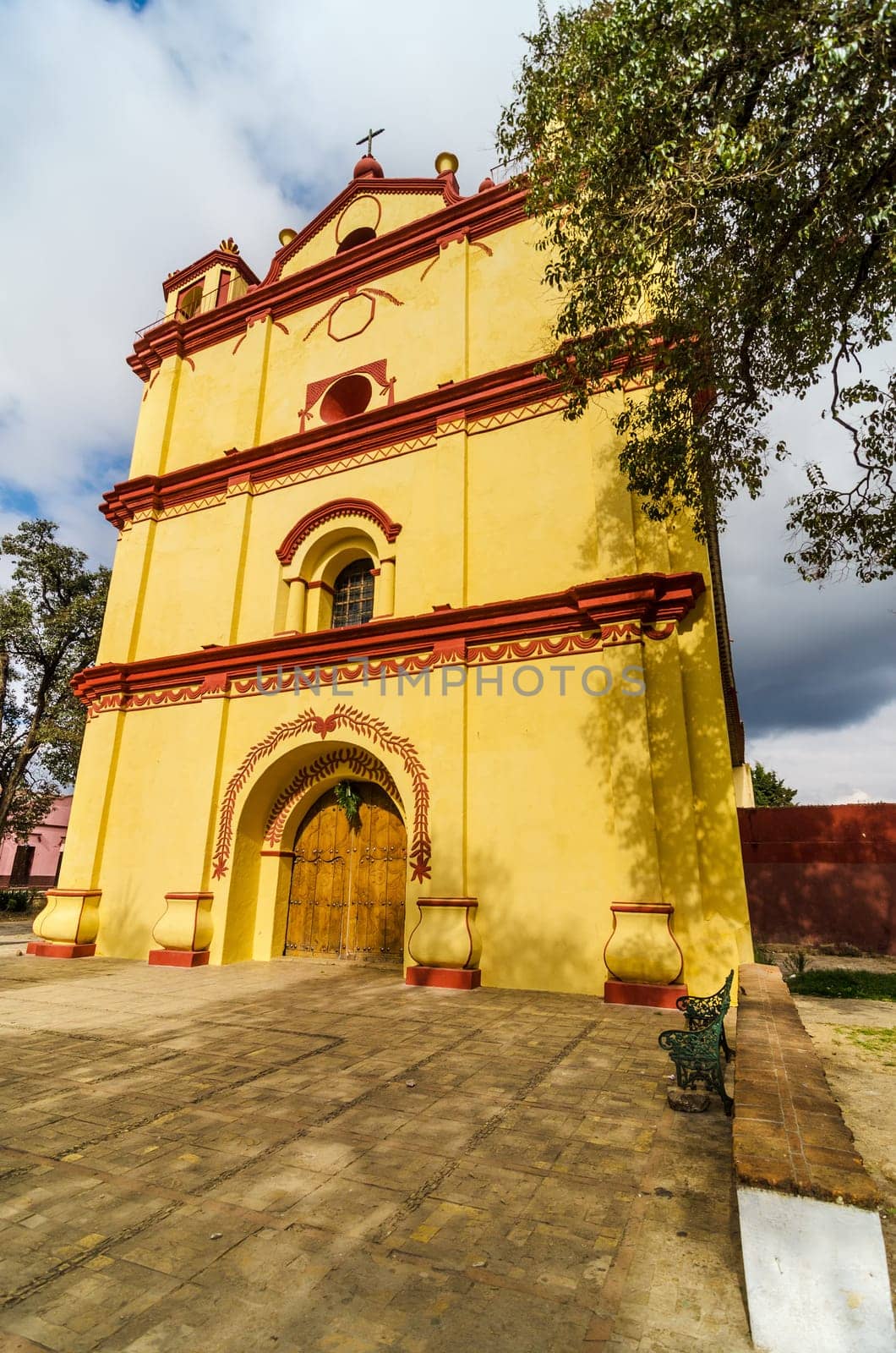 Beautiful yellow and red colonial church in San Cristobal de las Casas in Chiapas, Mexico