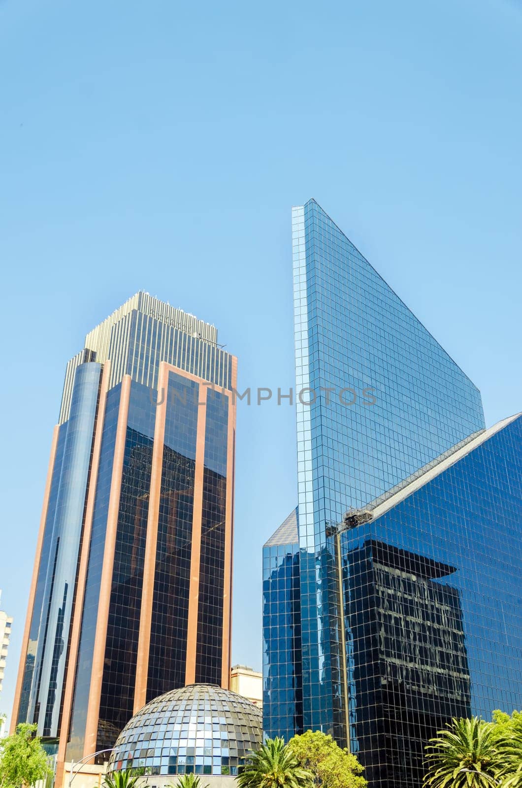 Two glass covered skyscrapers in a financial district