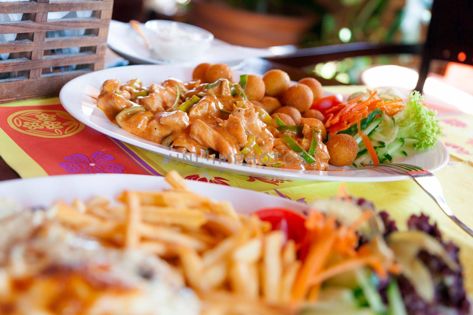 chinese food with croquettes and vegetable