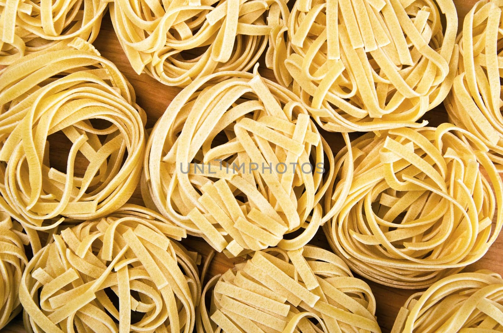 Raw tagliatelle close-up background