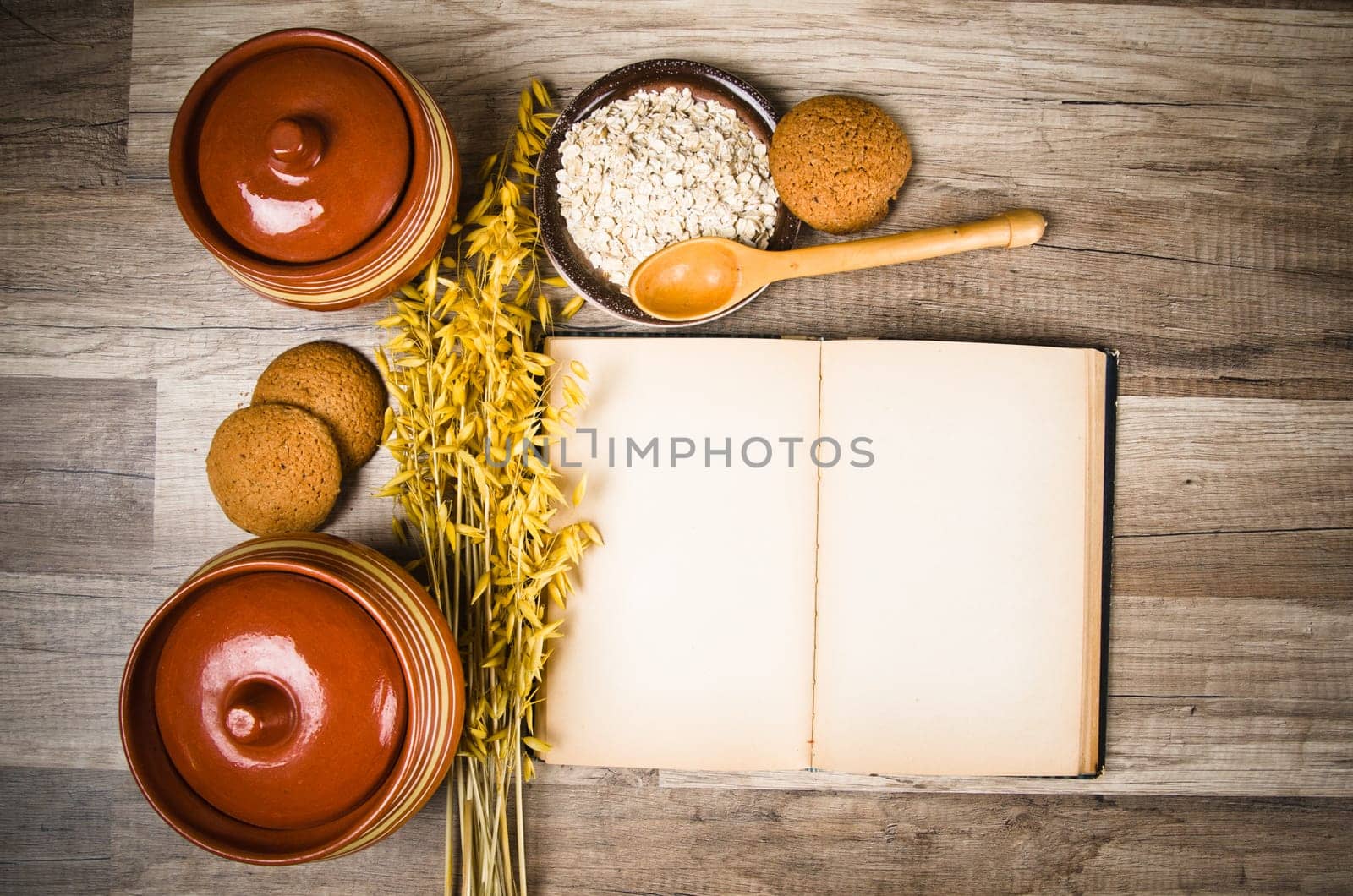 Oatmeal cookies and an old recipe book on the kitchen table