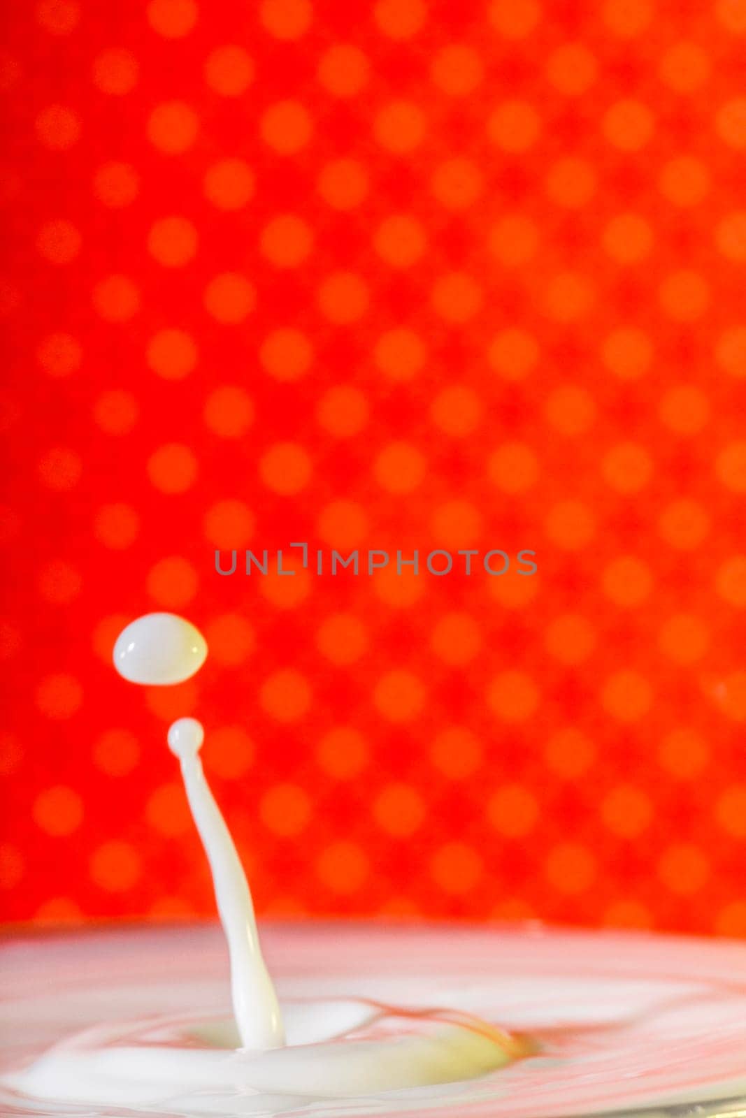Beautiful close up view of a drop of milk.