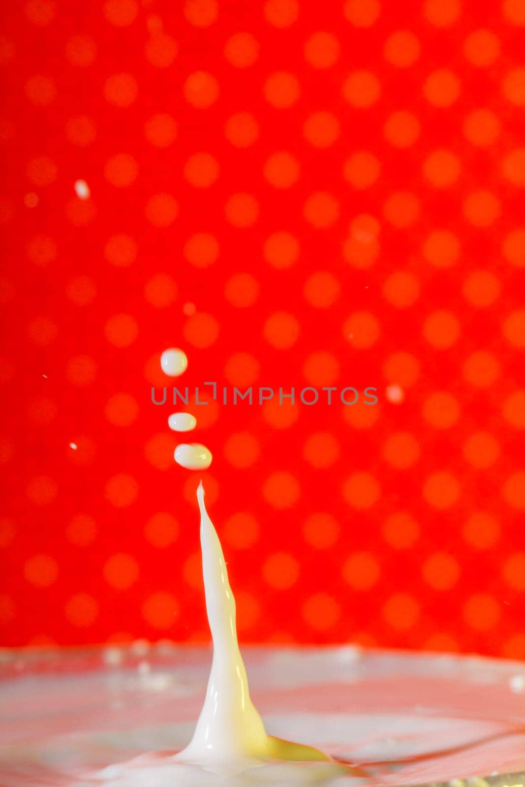 Beautiful close up view of a drop of milk.