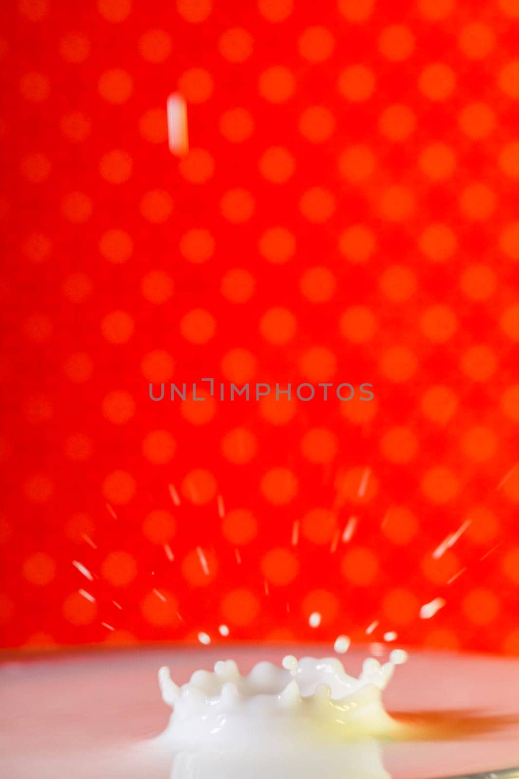 Beautiful close up view of a drop of milk.