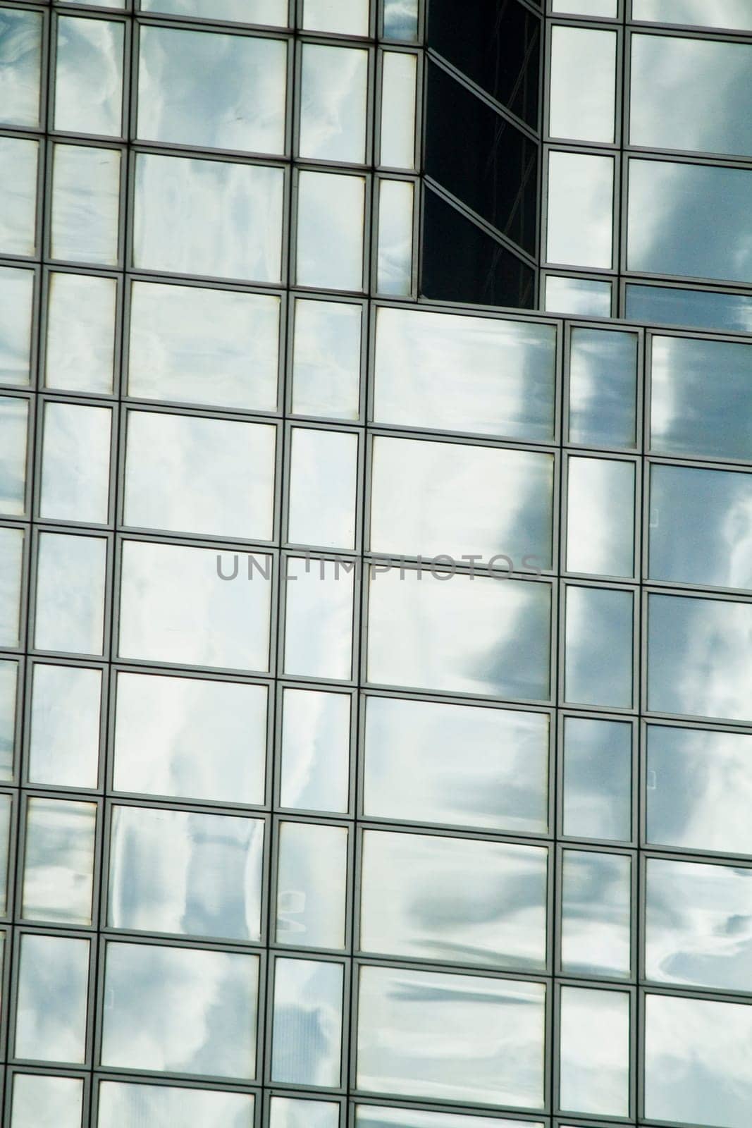 View of a modern and shiny glass skyscraper.