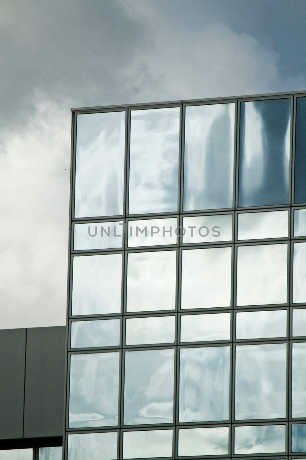 View of a modern and shiny glass skyscraper.