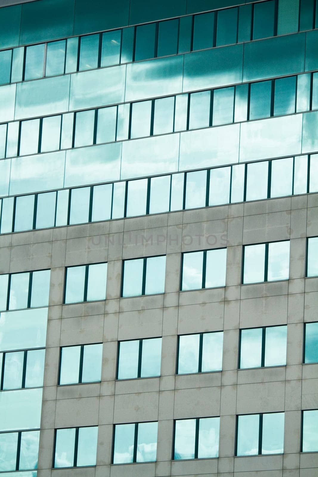 View of a modern and shiny glass skyscraper.