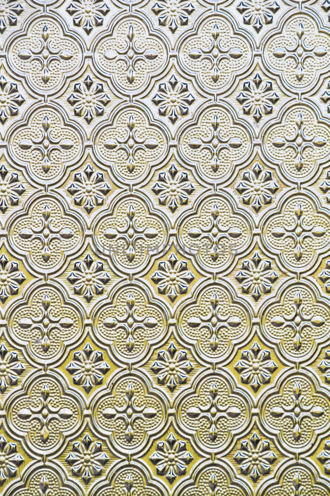 Close view of the flower texture in a glass window.