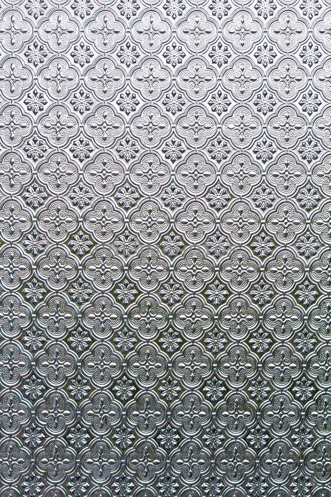 Close view of the flower texture in a glass window.