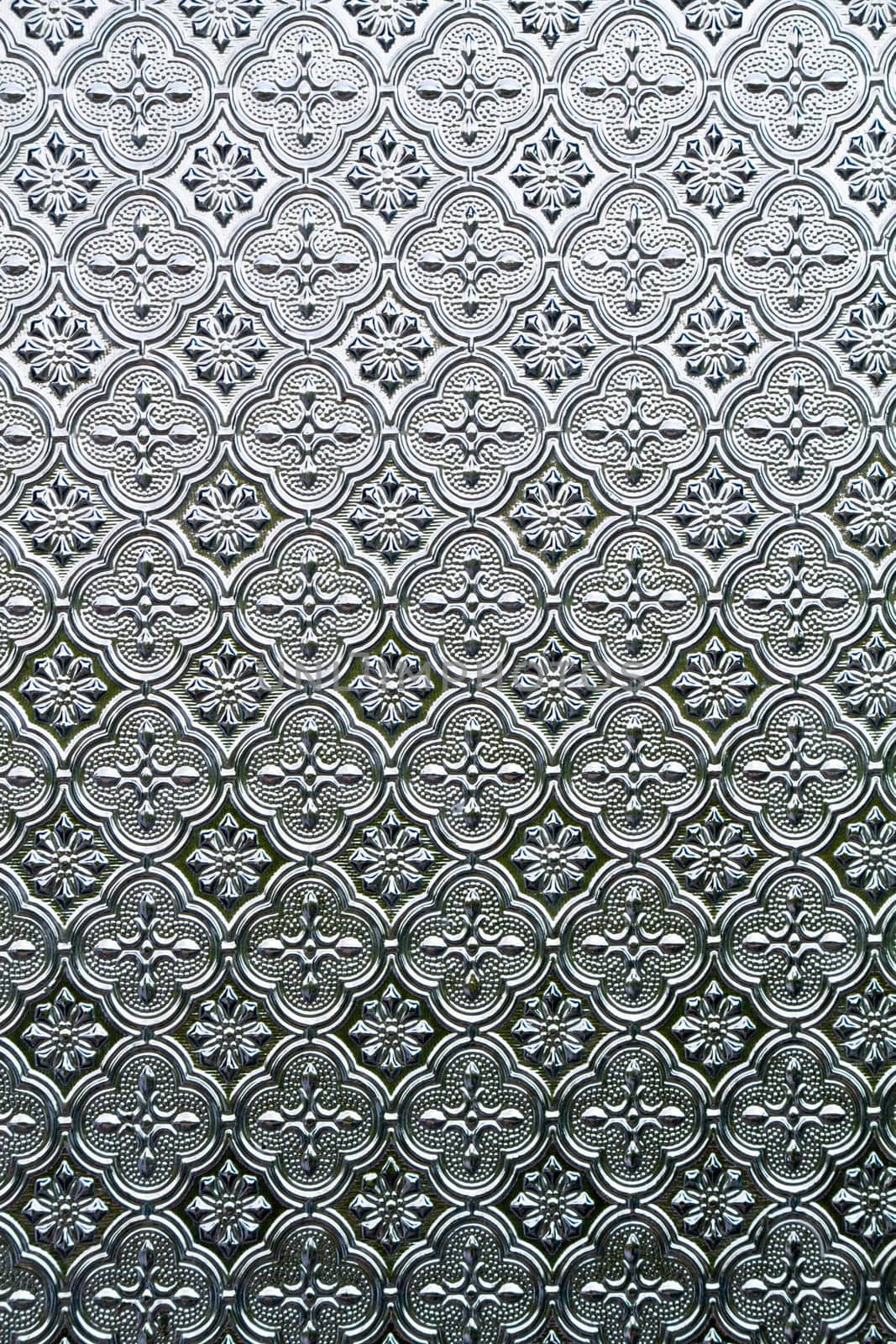 Close view of the flower texture in a glass window.
