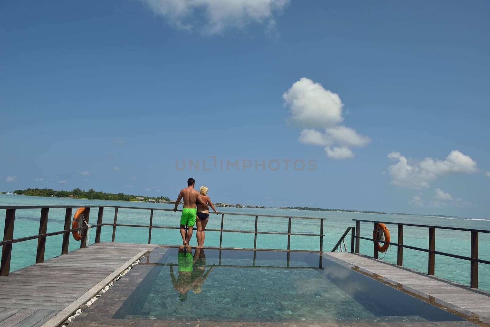 happy young  couple at summer vacation have fun and relax at beautiful sunny  day on beach