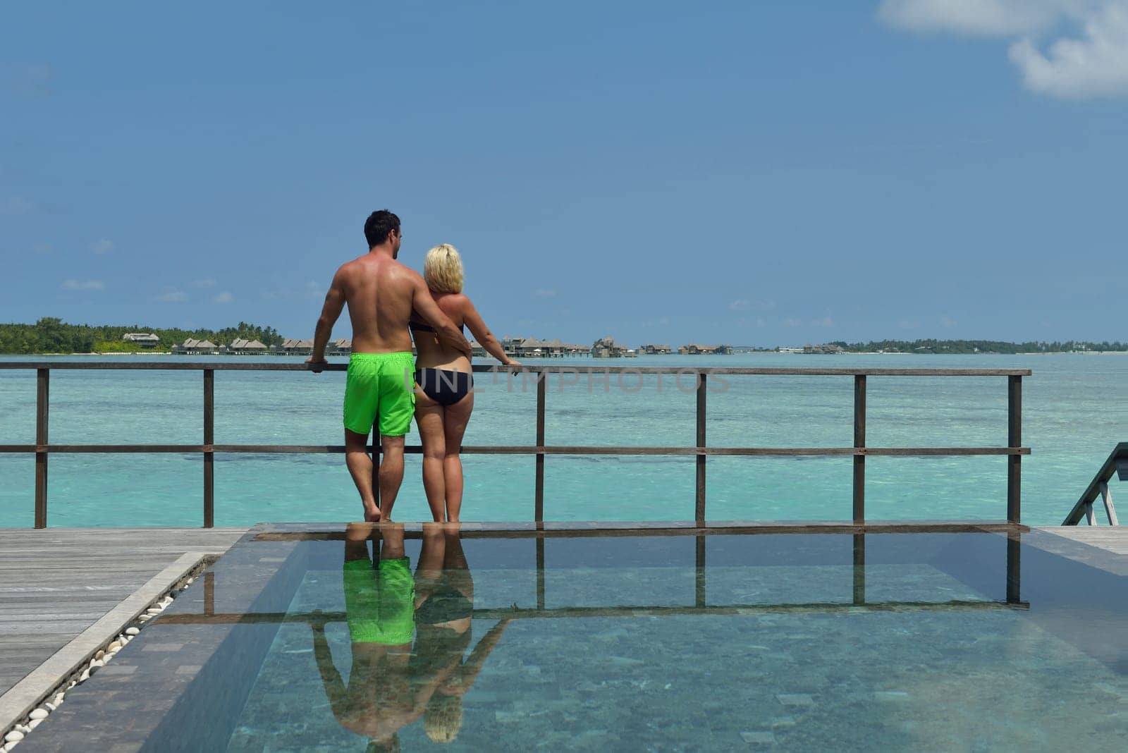 happy young  couple at summer vacation have fun and relax at beautiful sunny  day on beach