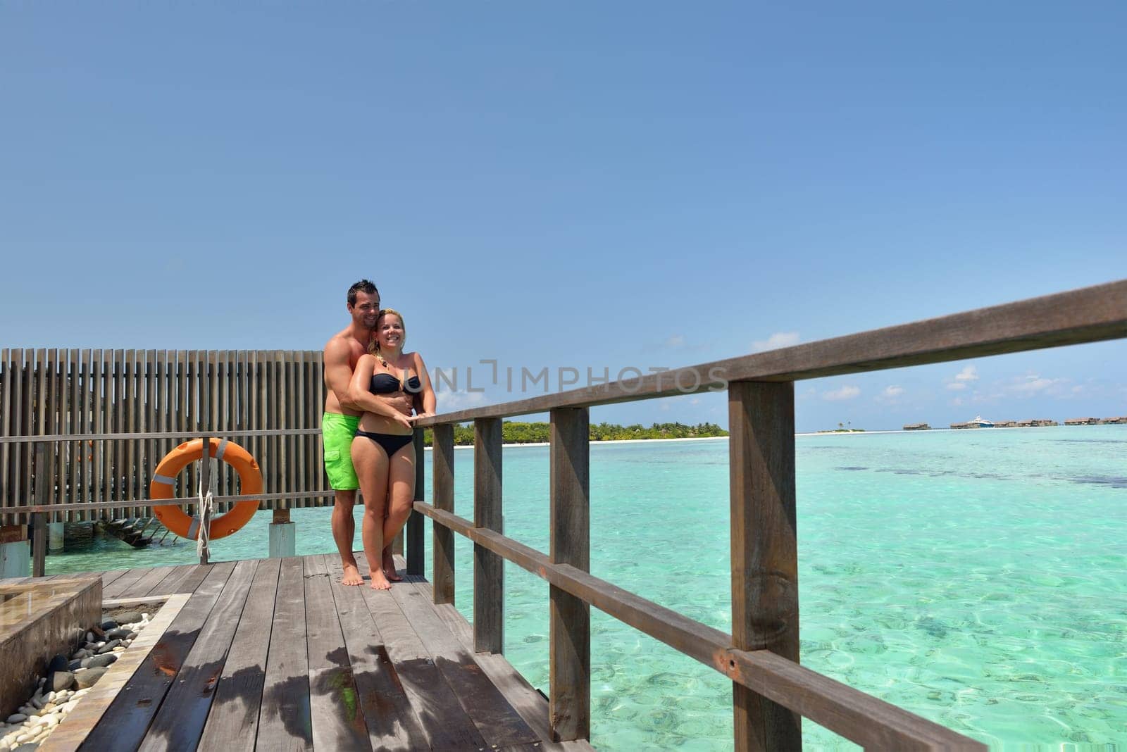 happy young  couple at summer vacation have fun and relax at beautiful sunny  day on beach