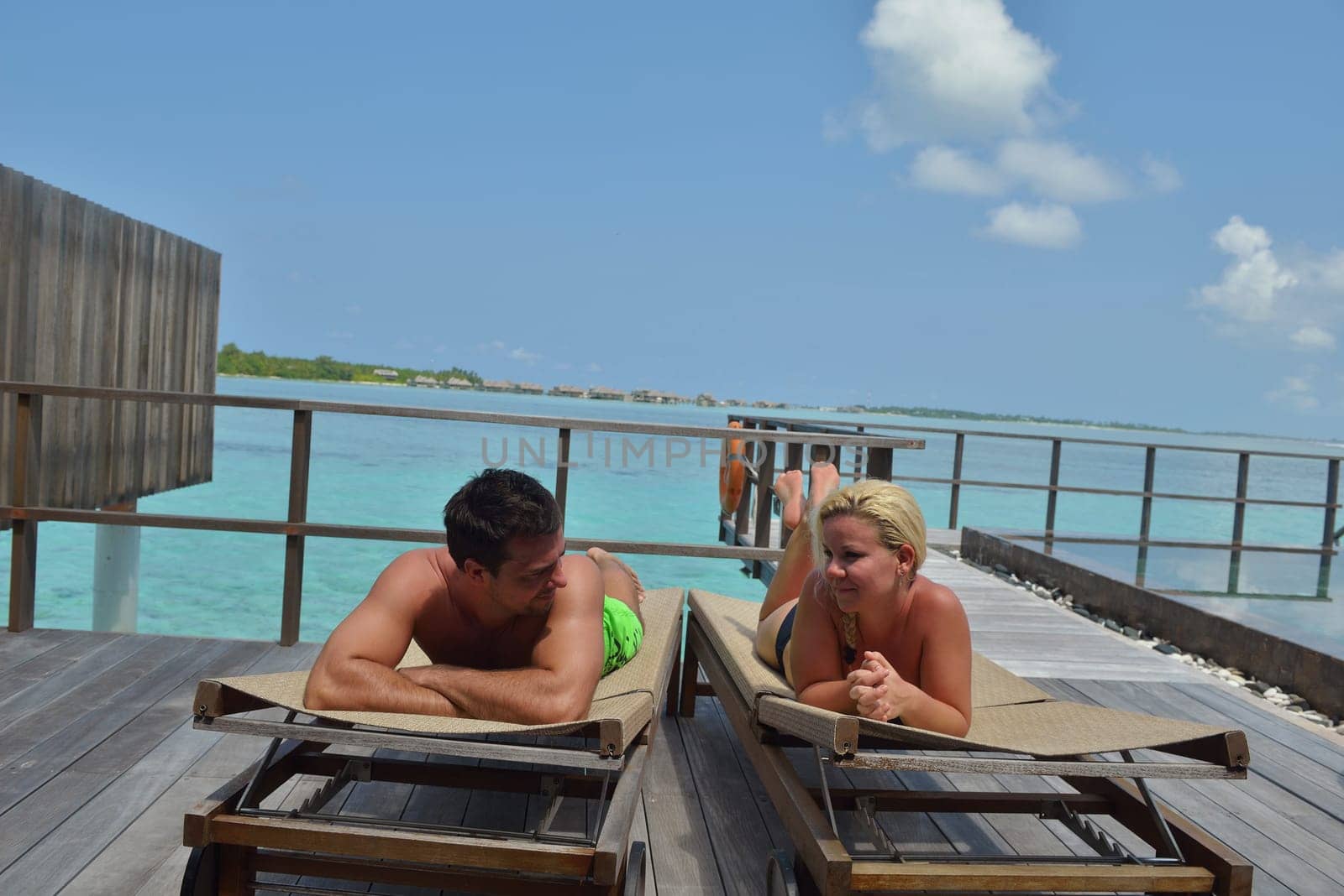 happy young  couple at summer vacation have fun and relax at beautiful sunny  day on beach