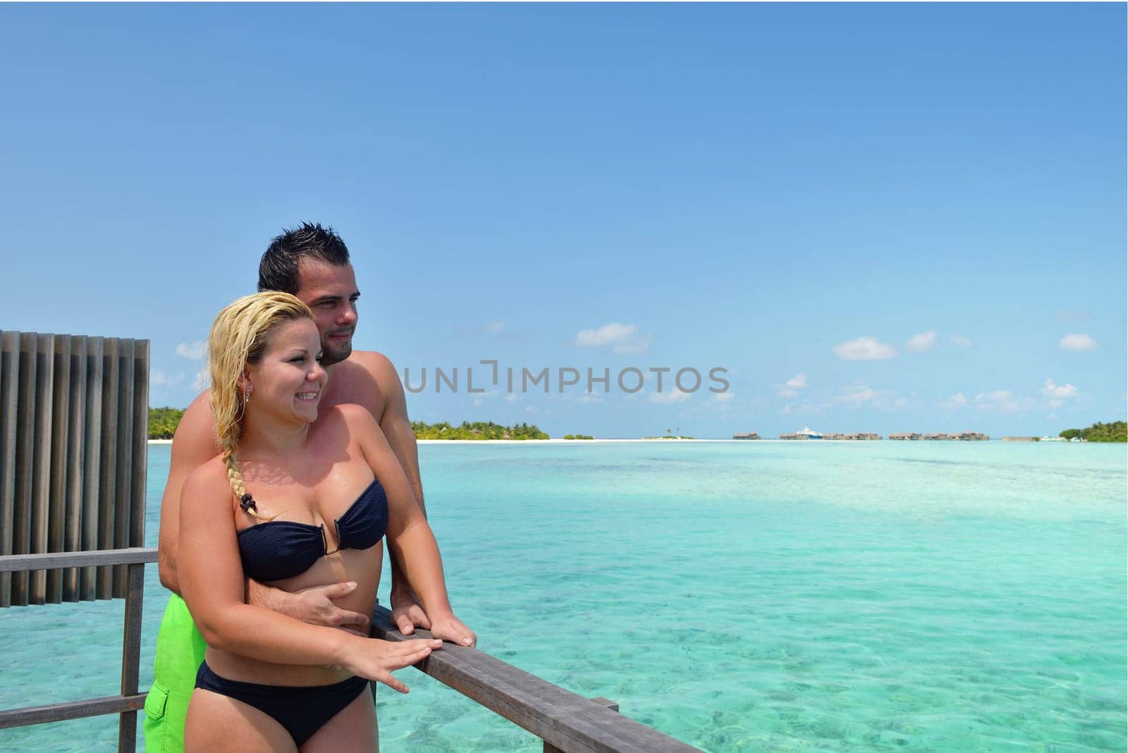 happy young  couple at summer vacation have fun and relax at beautiful sunny  day on beach