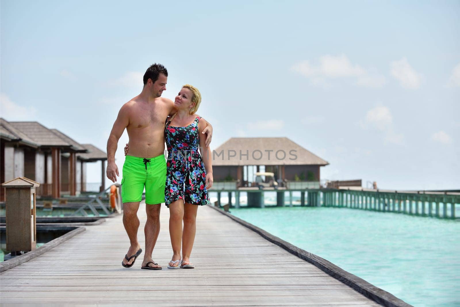 happy young  couple at summer vacation have fun and relax at beautiful sunny  day on beach
