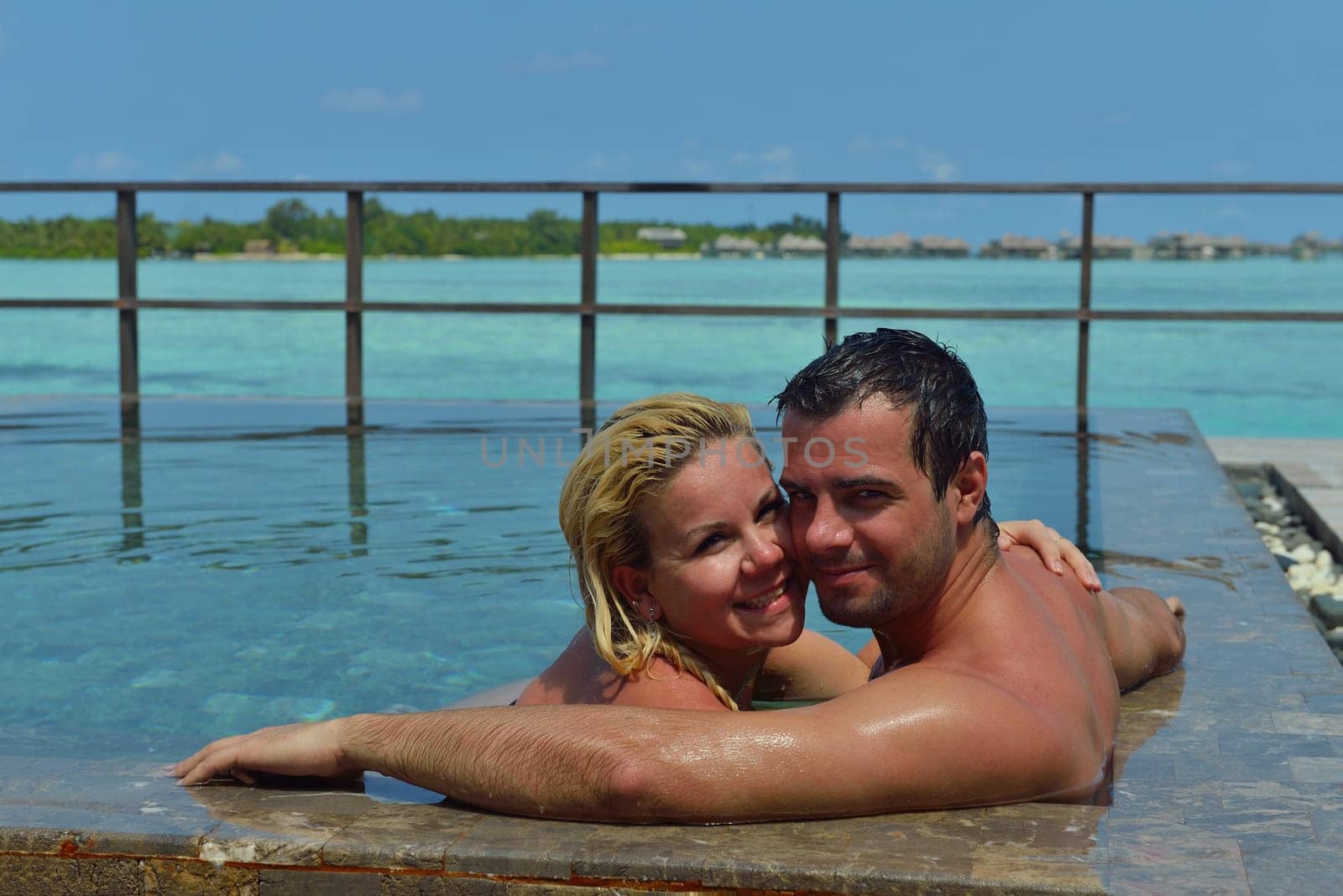 happy young  couple at summer vacation have fun and relax at beautiful sunny  day on beach