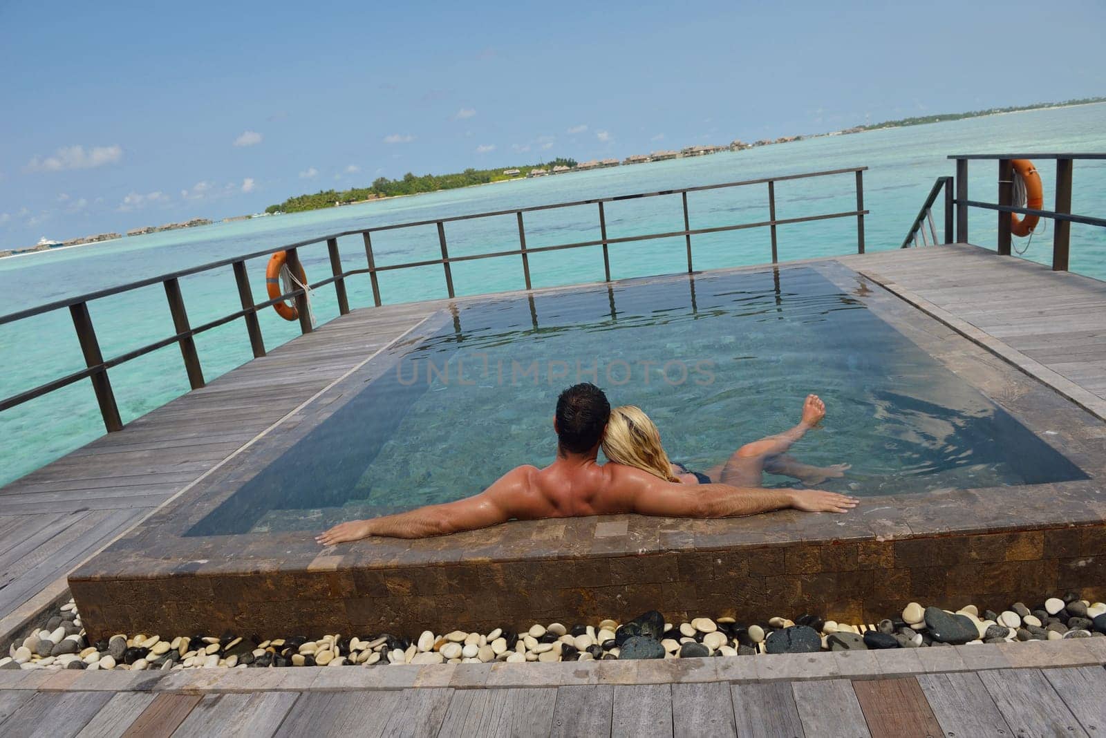 happy young  couple at summer vacation have fun and relax at beautiful sunny  day on beach