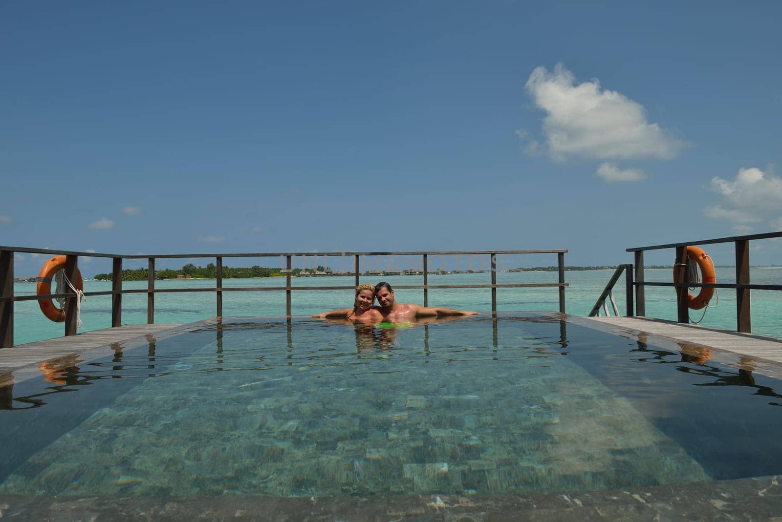 happy young  couple at summer vacation have fun and relax at beautiful sunny  day on beach
