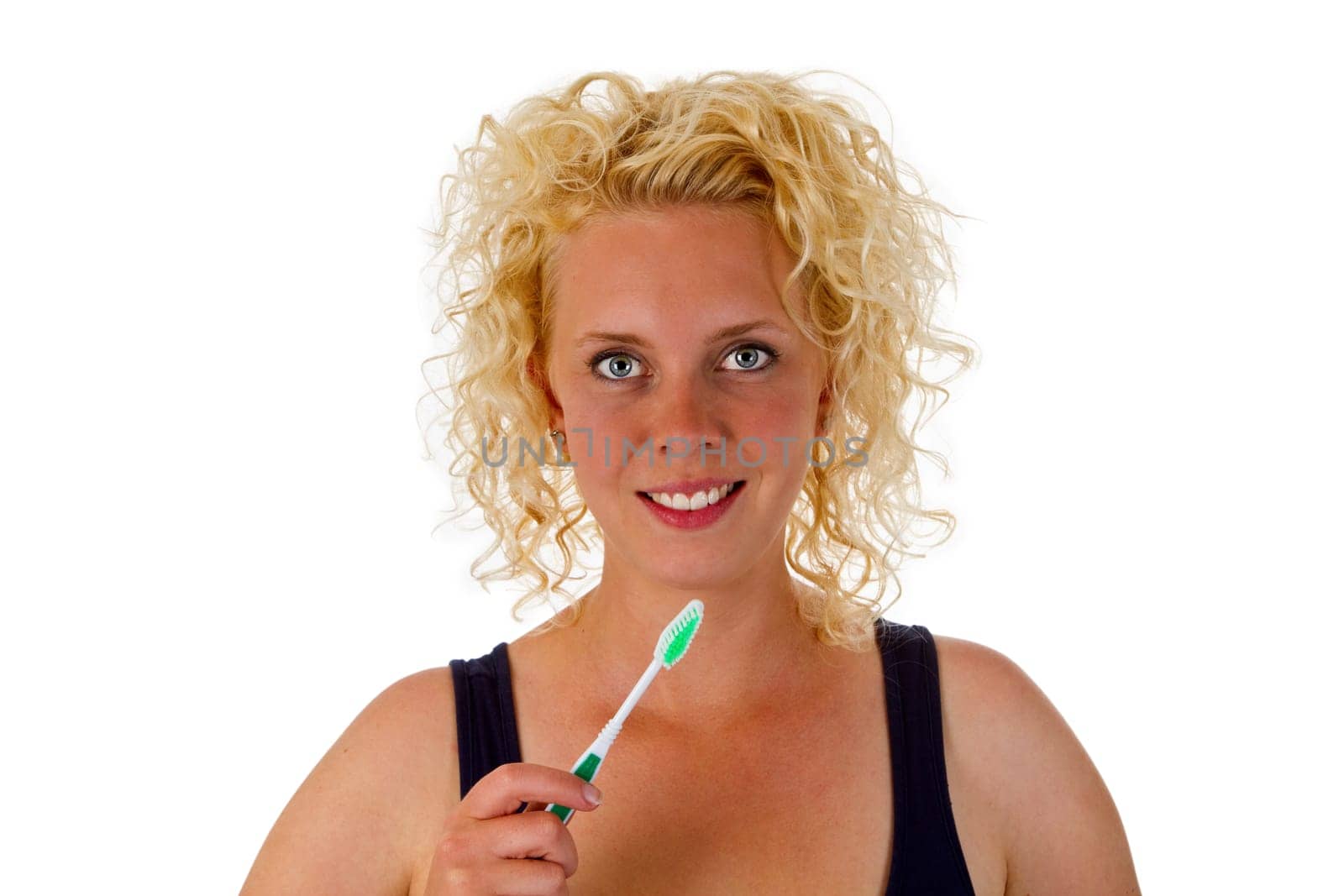 Young woman with toothbrush exposed on white background