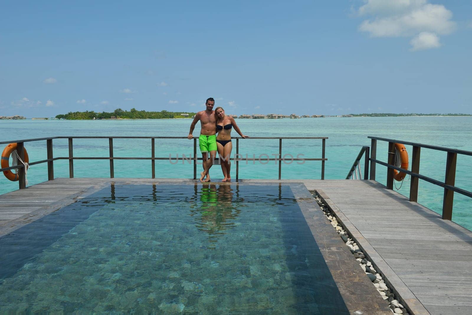 happy young  couple at summer vacation have fun and relax at beautiful sunny  day on beach