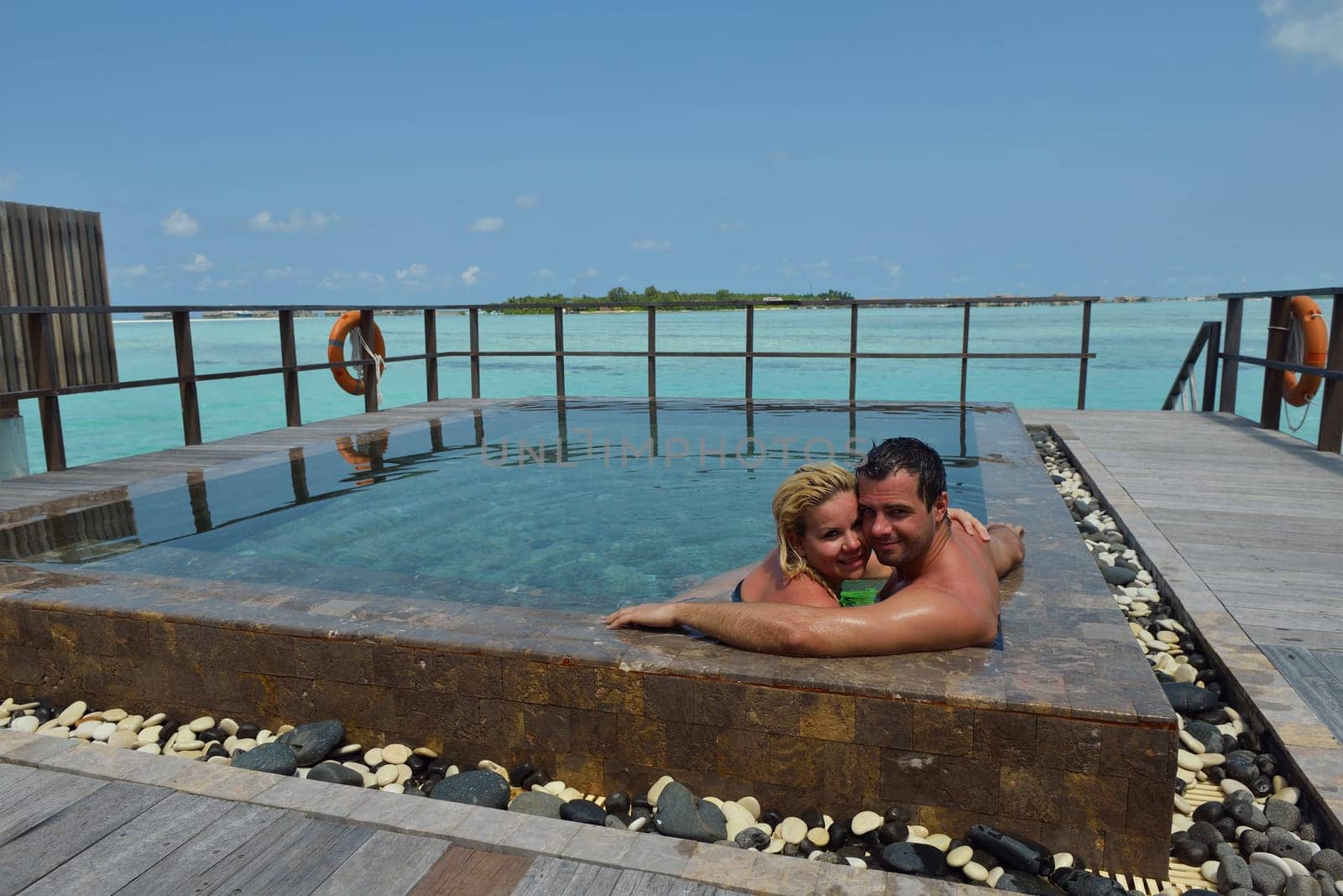 happy young  couple at summer vacation have fun and relax at beautiful sunny  day on beach