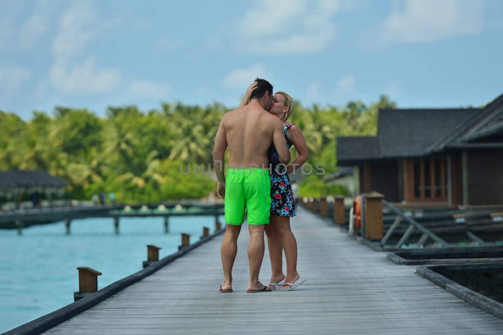 happy young  couple at summer vacation have fun and relax at beautiful sunny  day on beach