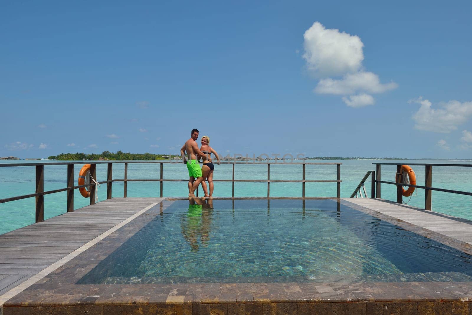happy young  couple at summer vacation have fun and relax at beautiful sunny  day on beach