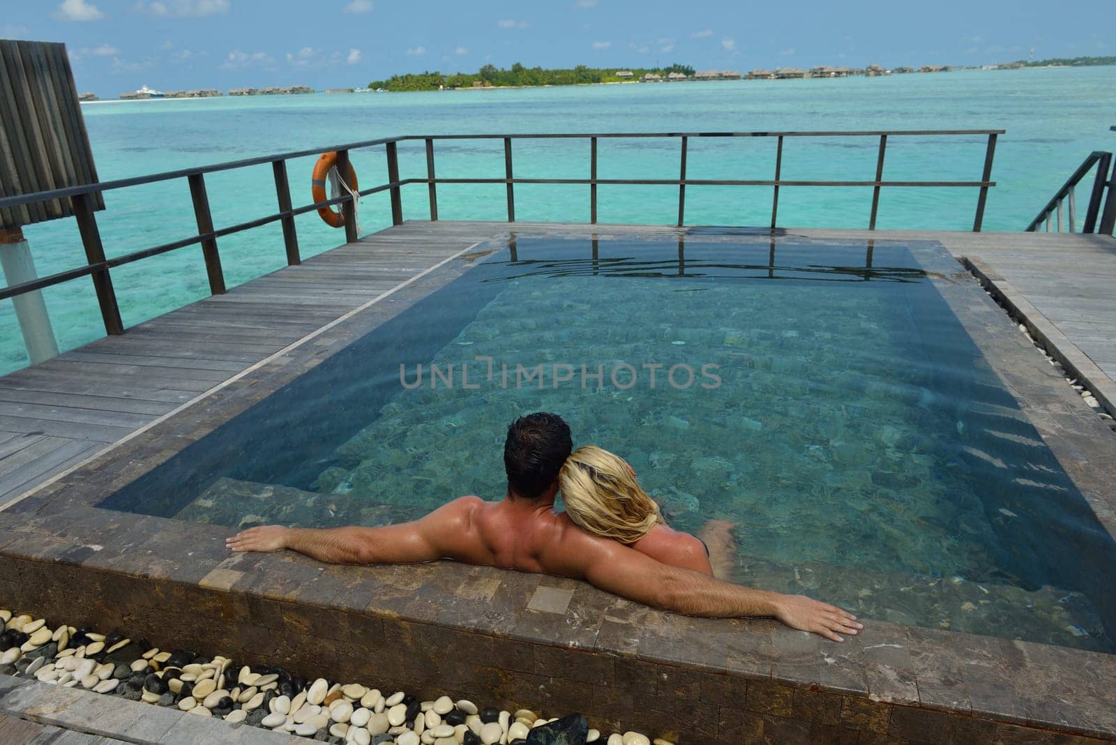 happy young  couple at summer vacation have fun and relax at beautiful sunny  day on beach