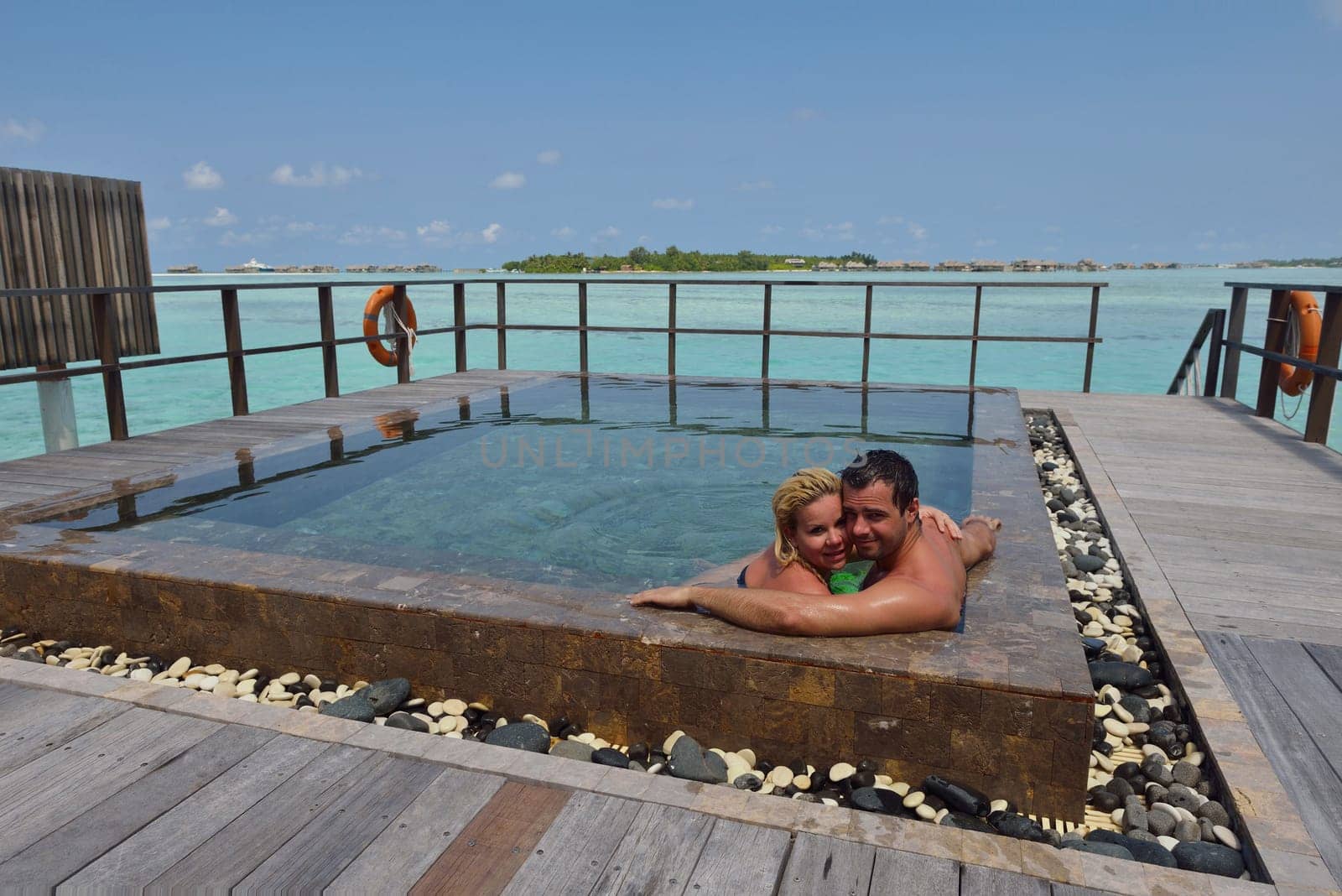 happy young  couple at summer vacation have fun and relax at beautiful sunny  day on beach
