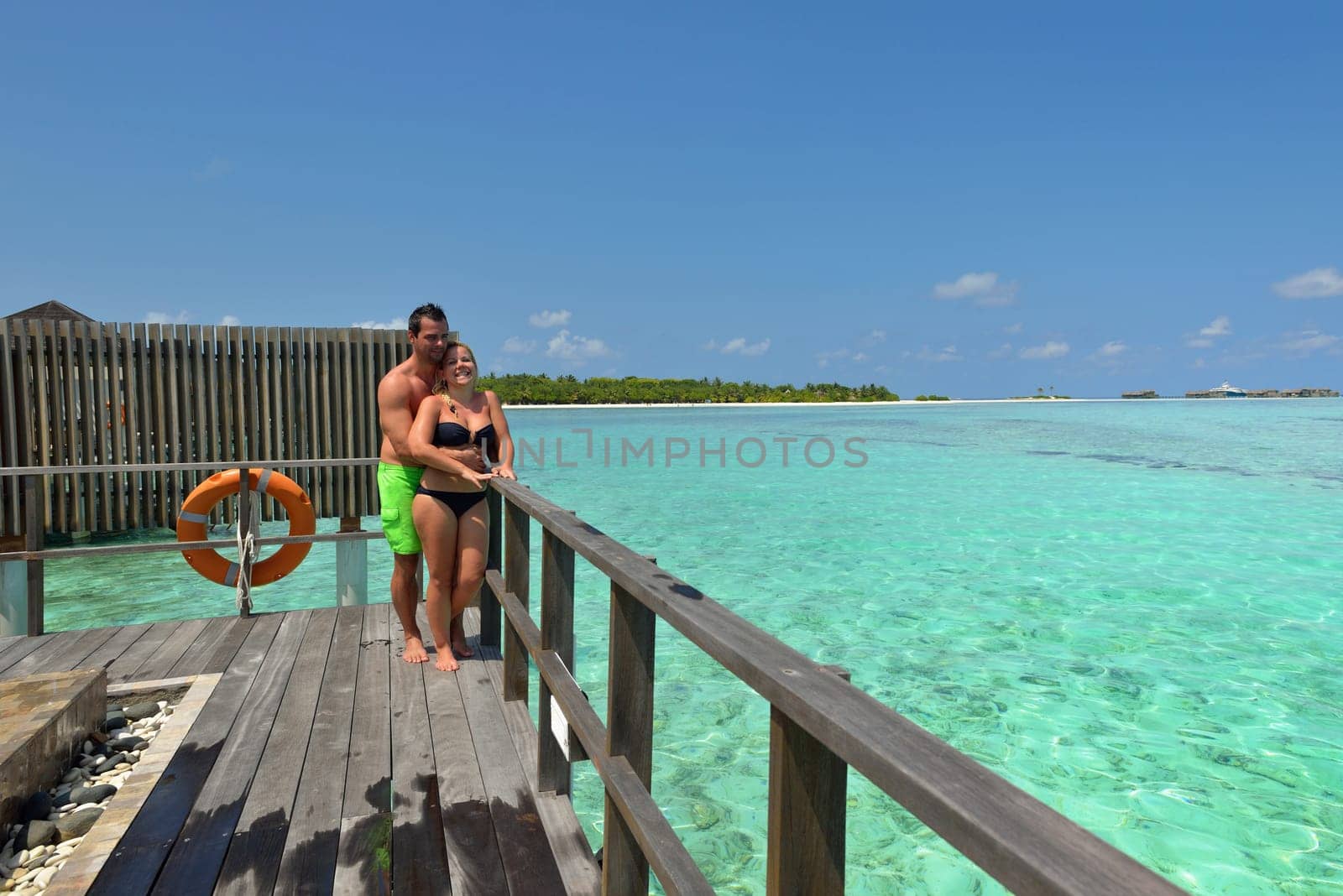 happy young  couple at summer vacation have fun and relax at beautiful sunny  day on beach