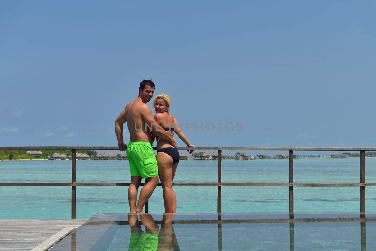 happy young  couple at summer vacation have fun and relax at beautiful sunny  day on beach