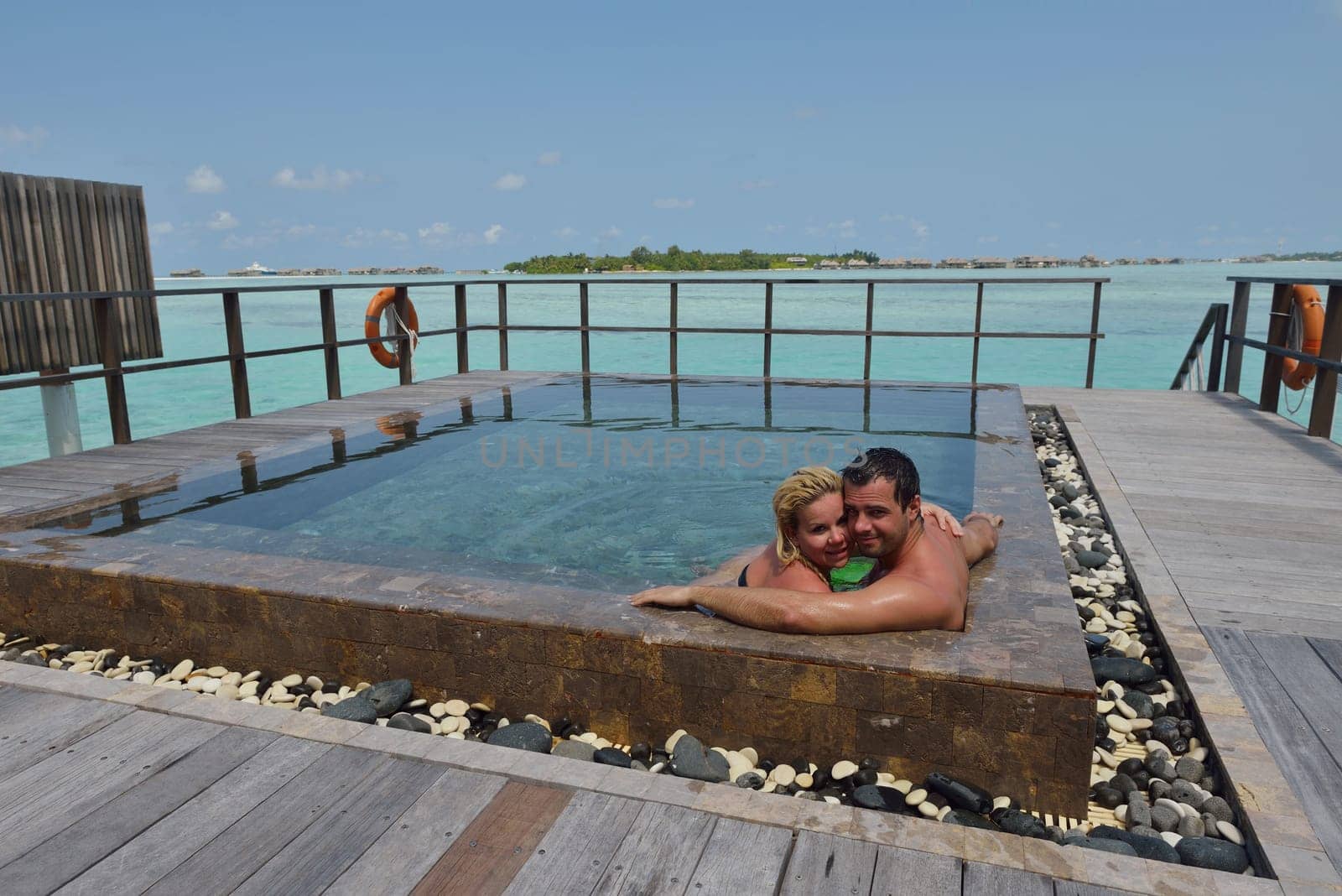 happy young  couple at summer vacation have fun and relax at beautiful sunny  day on beach