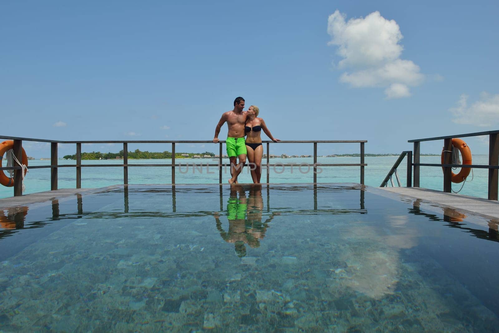 happy young  couple at summer vacation have fun and relax at beautiful sunny  day on beach