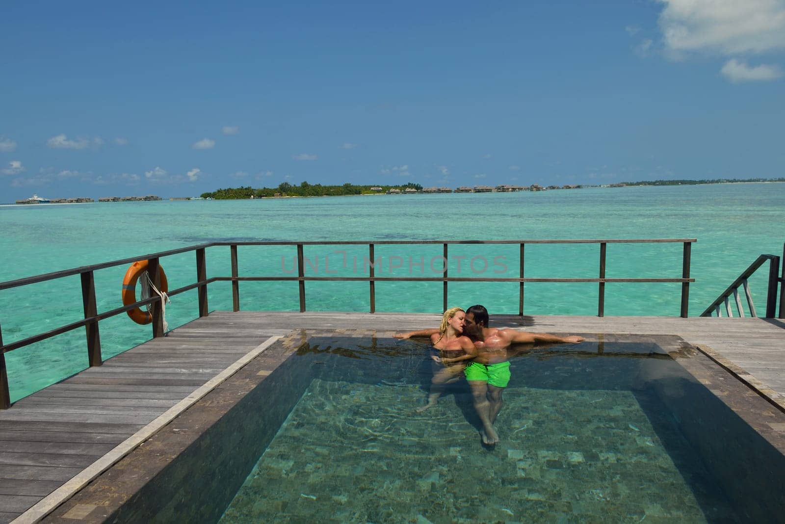 happy young  couple at summer vacation have fun and relax at beautiful sunny  day on beach