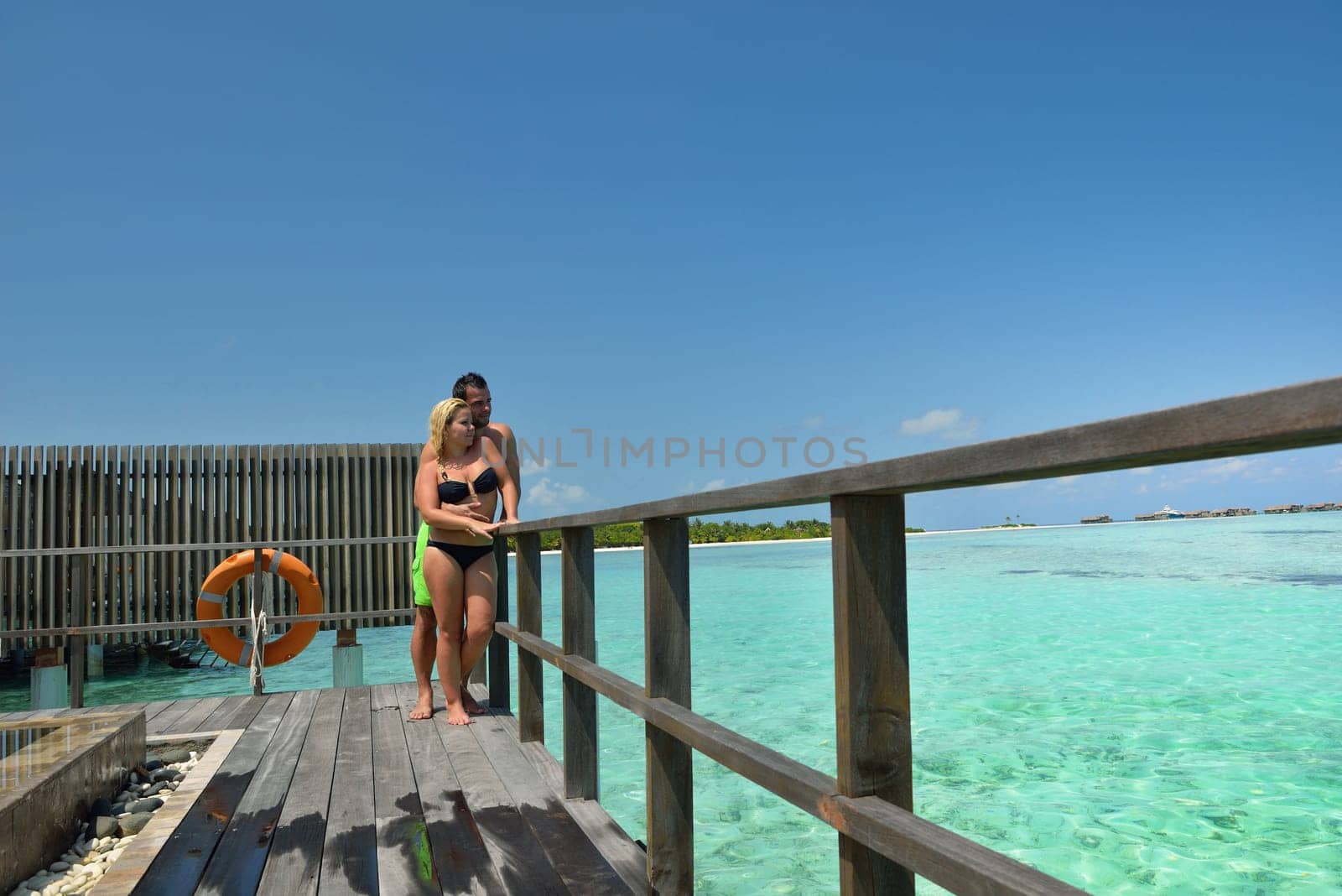 happy young  couple at summer vacation have fun and relax at beautiful sunny  day on beach