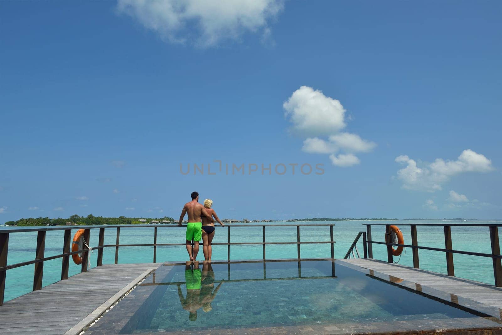 happy young  couple at summer vacation have fun and relax at beautiful sunny  day on beach