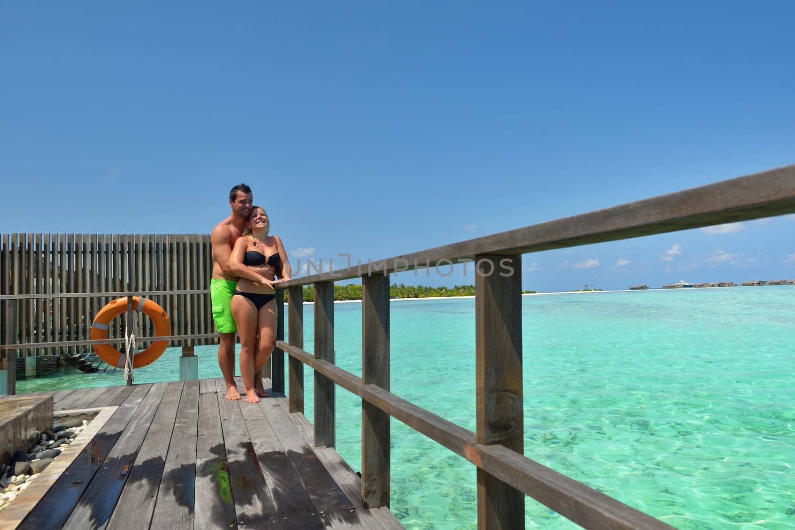 happy young  couple at summer vacation have fun and relax at beautiful sunny  day on beach