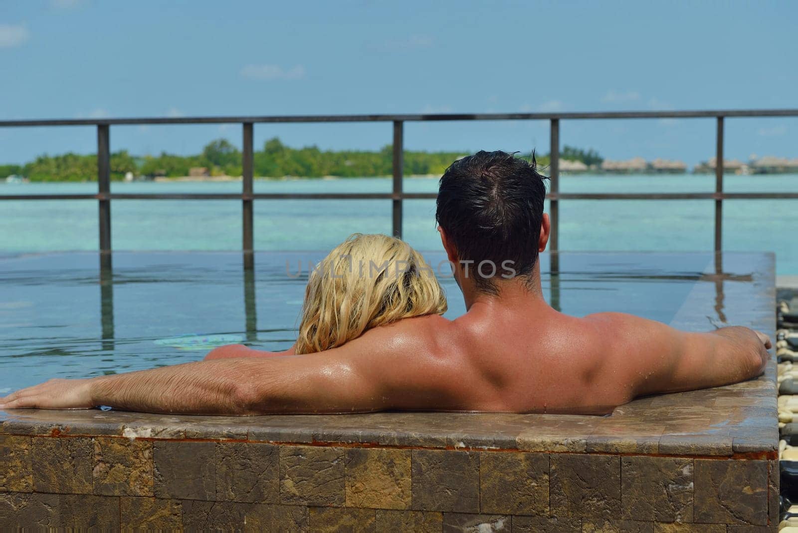happy young  couple at summer vacation have fun and relax at beautiful sunny  day on beach