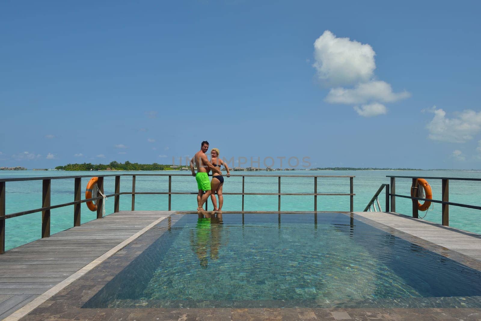 happy young  couple at summer vacation have fun and relax at beautiful sunny  day on beach