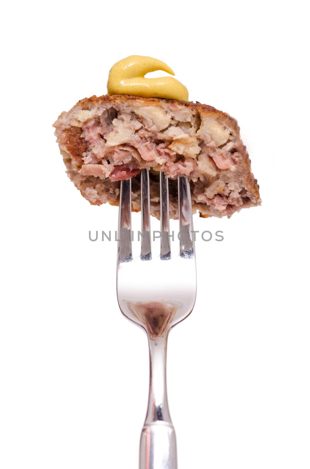 Meatball with mustard on a fork